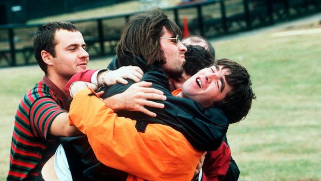 Oasis - Liam Gallagher attempts to kiss brother Noel