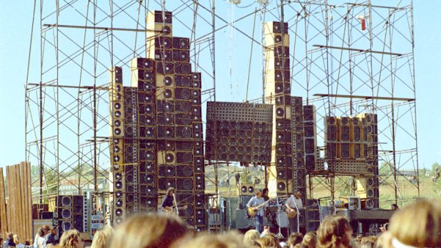 Grateful Dead play in front of their Wall of Sound